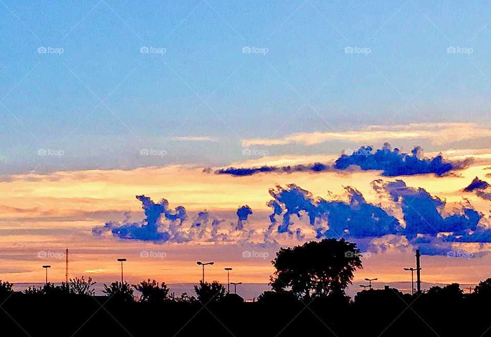 Cloud formations at sunsets in bright, colorful  