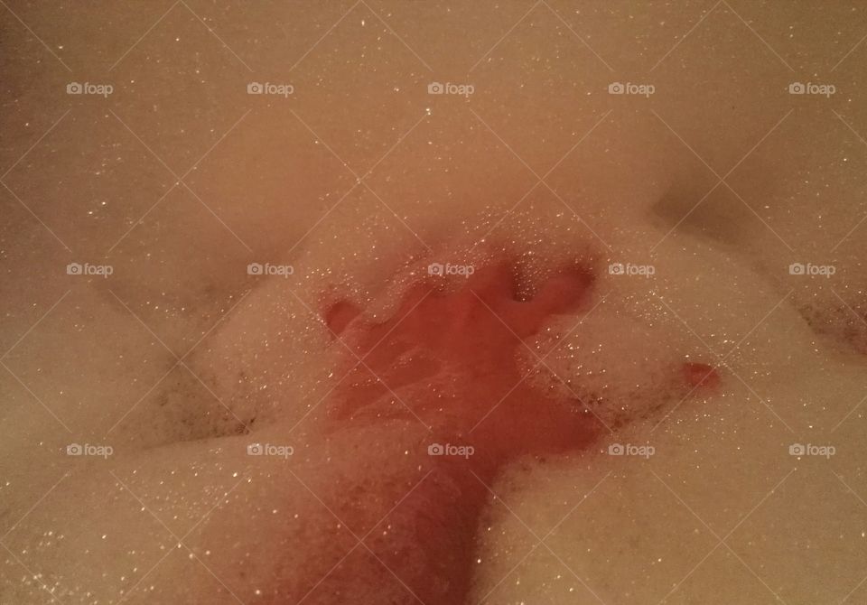 hand in a bath foam
