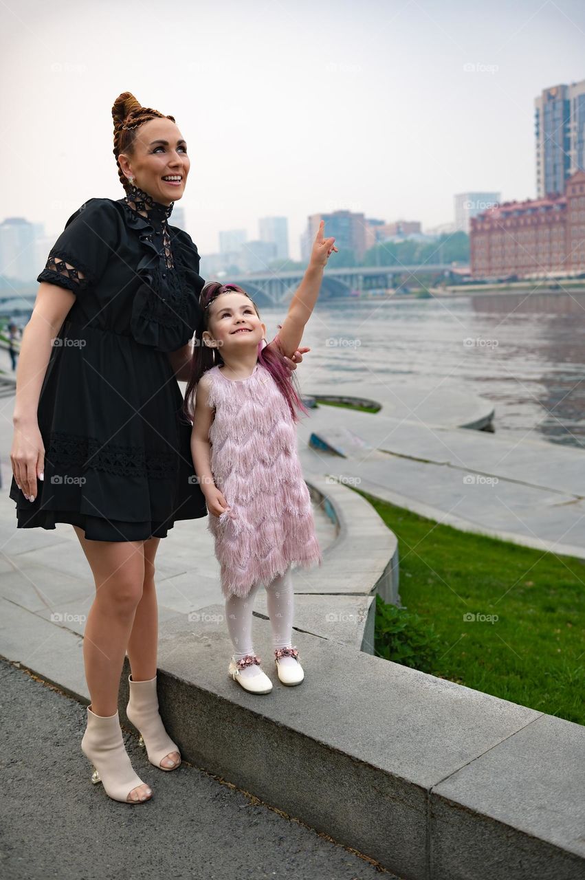 Family walks on the embankment 