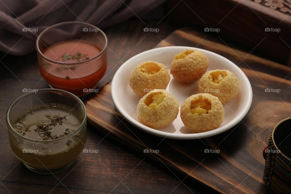 Indian food Gol Gappe, pani puri or Puchka with flavored water
