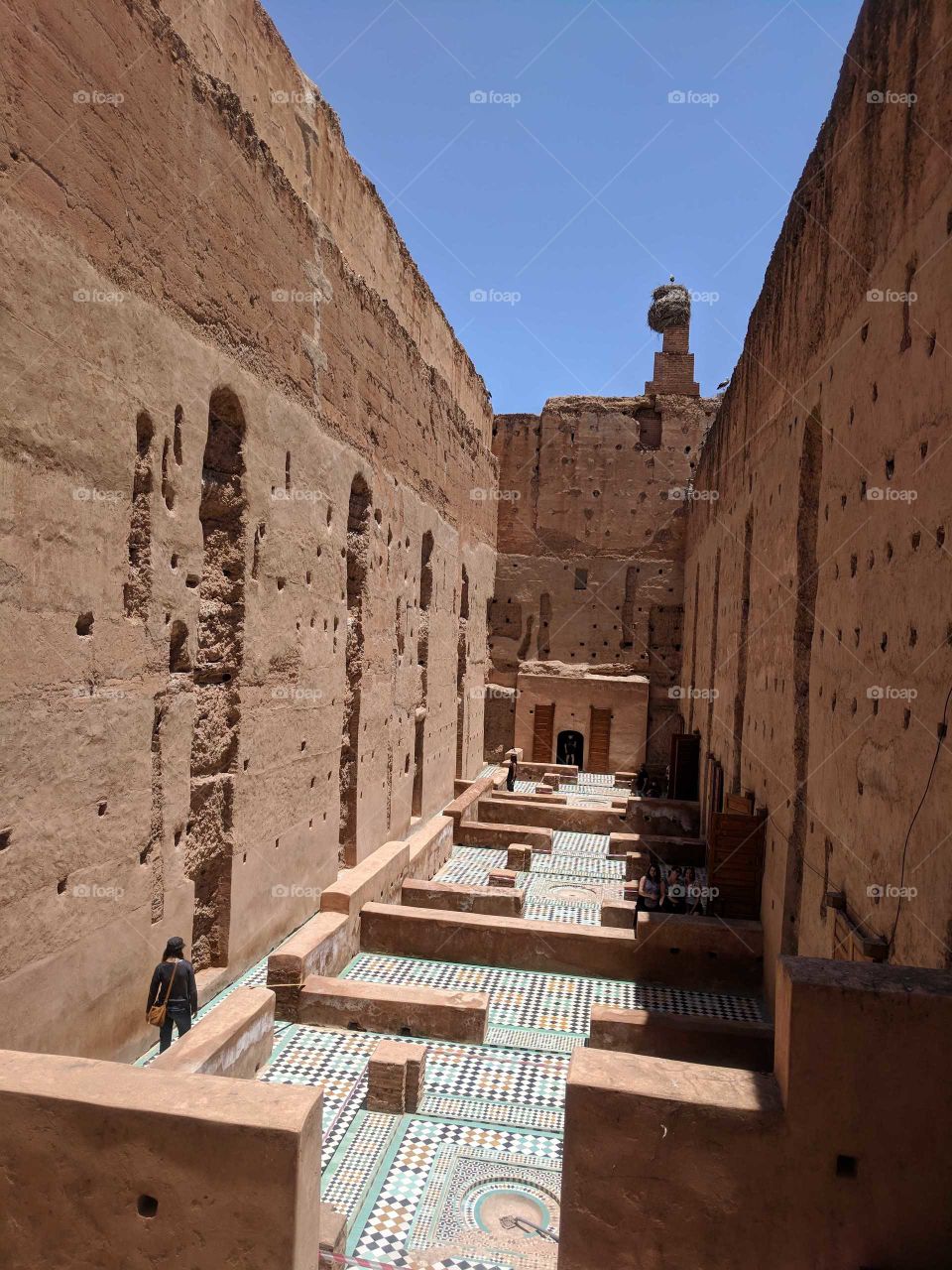 Exploring the Ancient Ruins of the Palais El Badi in Marrakech in Morocco - Colorful Ceramic Tile Mosaic Floors and Brown Stone and Clay Walls