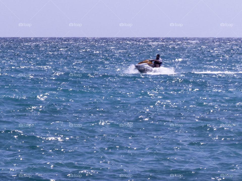 Speeding along the waves of the big blue ocean 