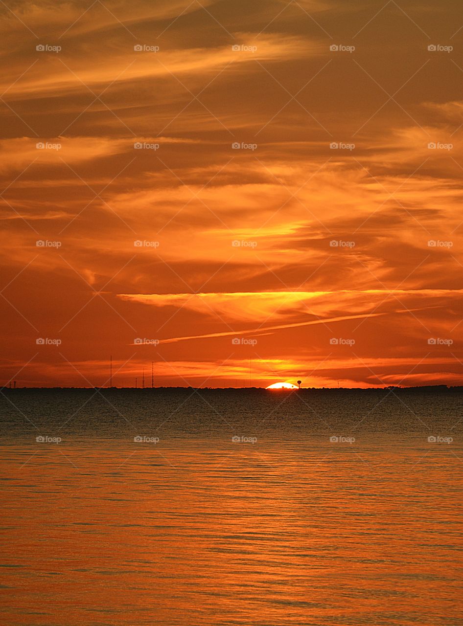 Amazing Silhouettes! Like the meeting of two worlds - the known and the unknown. The sun is like a great bigy romantic, inspirational fire in the sky. Brilliant streaks of yellow, orange, gold, blue, pink and red overcome the blue and purple of the sky. The sky resembled a prism; all the colors blended perfectly together. It's as if the colors and intensity of the light is just right! My work is done for today. I'm not sure what tomorrow will bring, but I'll be prepared for it! 