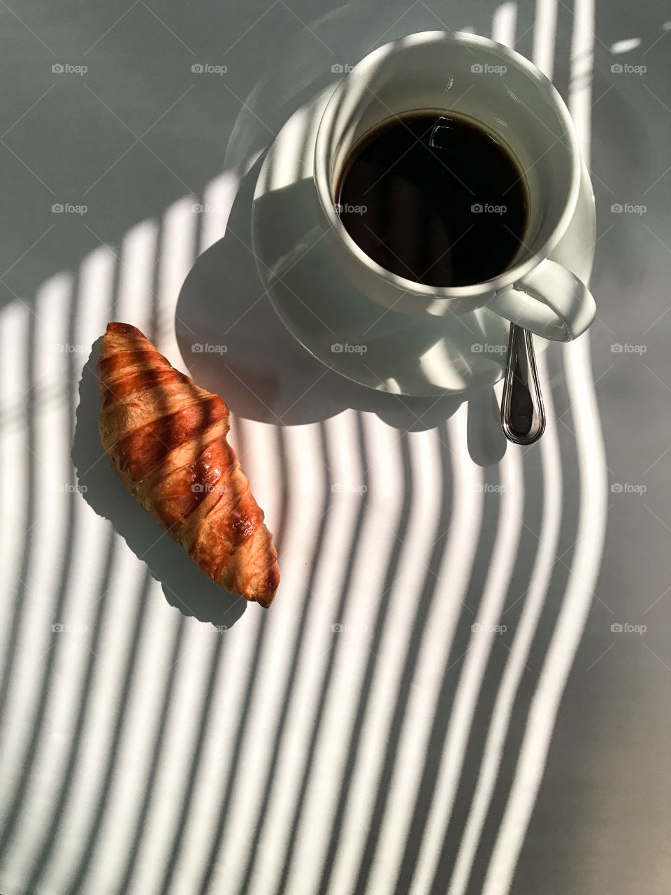 Fresh coffee beside office window 