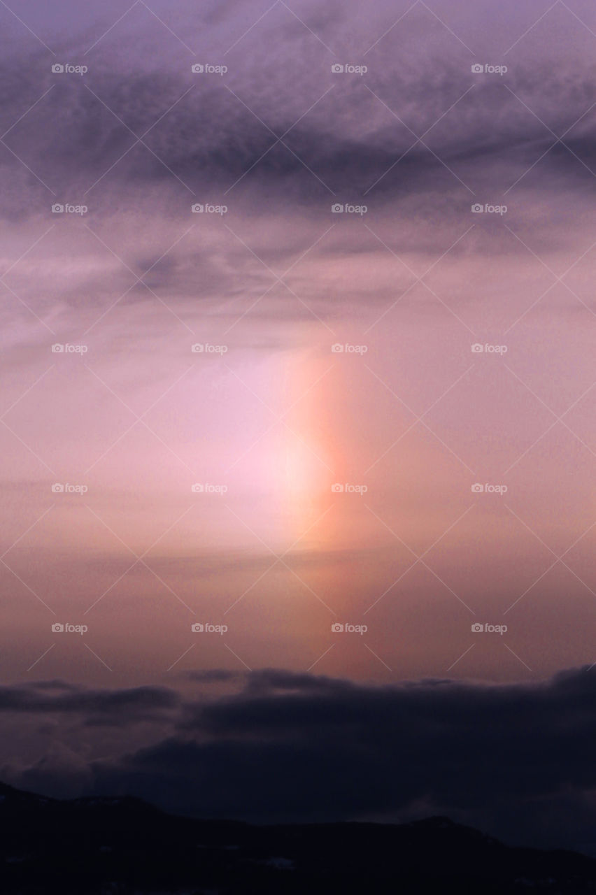 Captured an interesting sky at sunset tonight. Interesting clouds and a beautiful sun dog (parhelion). Playing with the light and filters to enhance the already beautiful event!