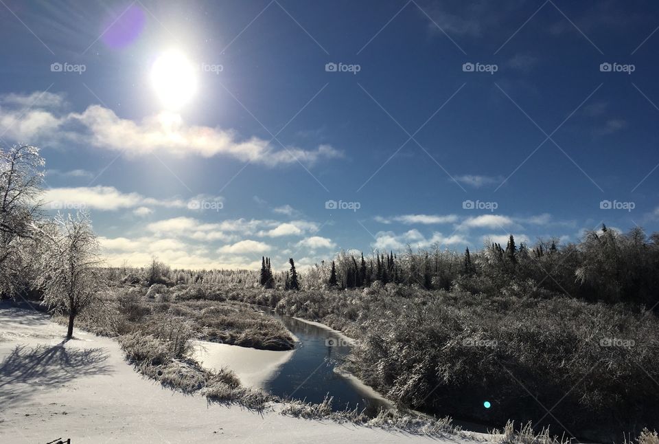 Winter landscape rising sun iver water