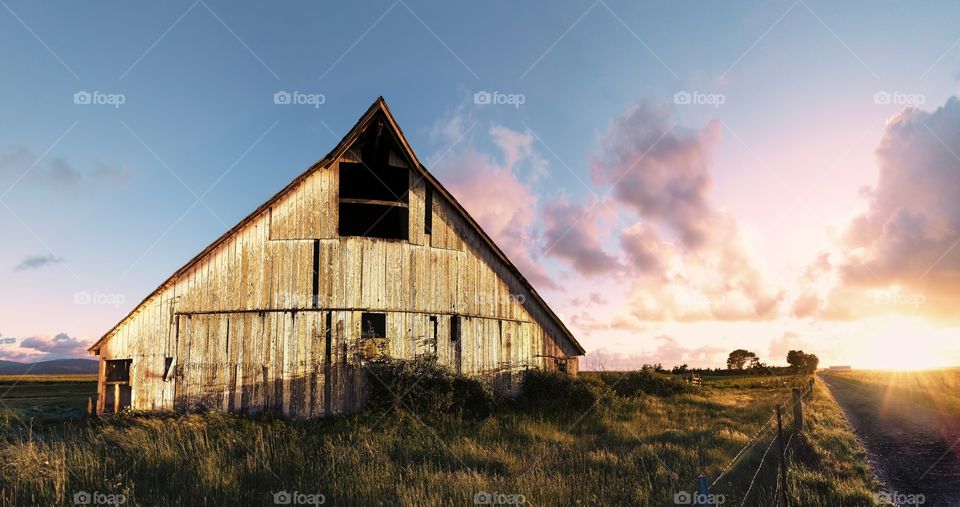 Old wooden barn In field