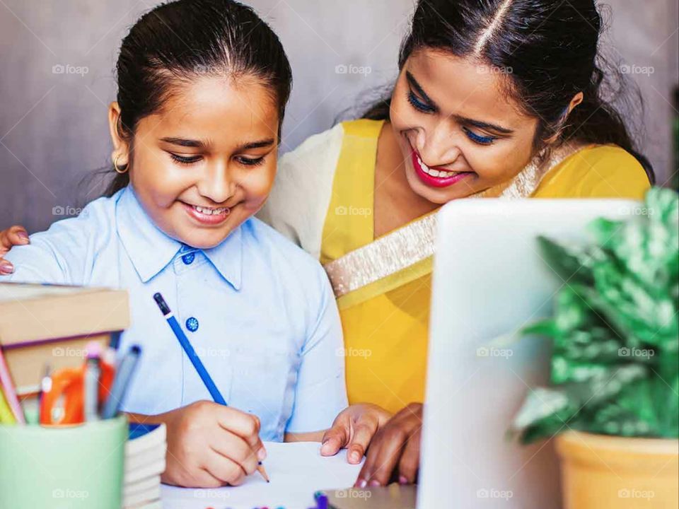 child studying with his mom