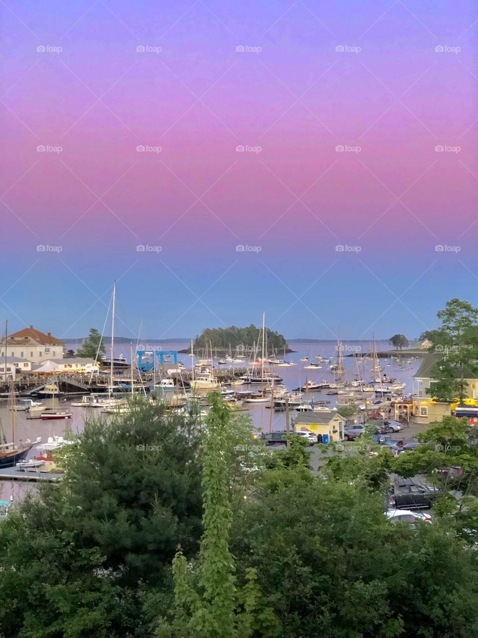 Scenic view of Camden Harbor at sunset from the rooftop deck of Camden Deli