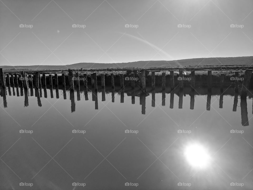 Beautiful black and white background of the reflection on the river.