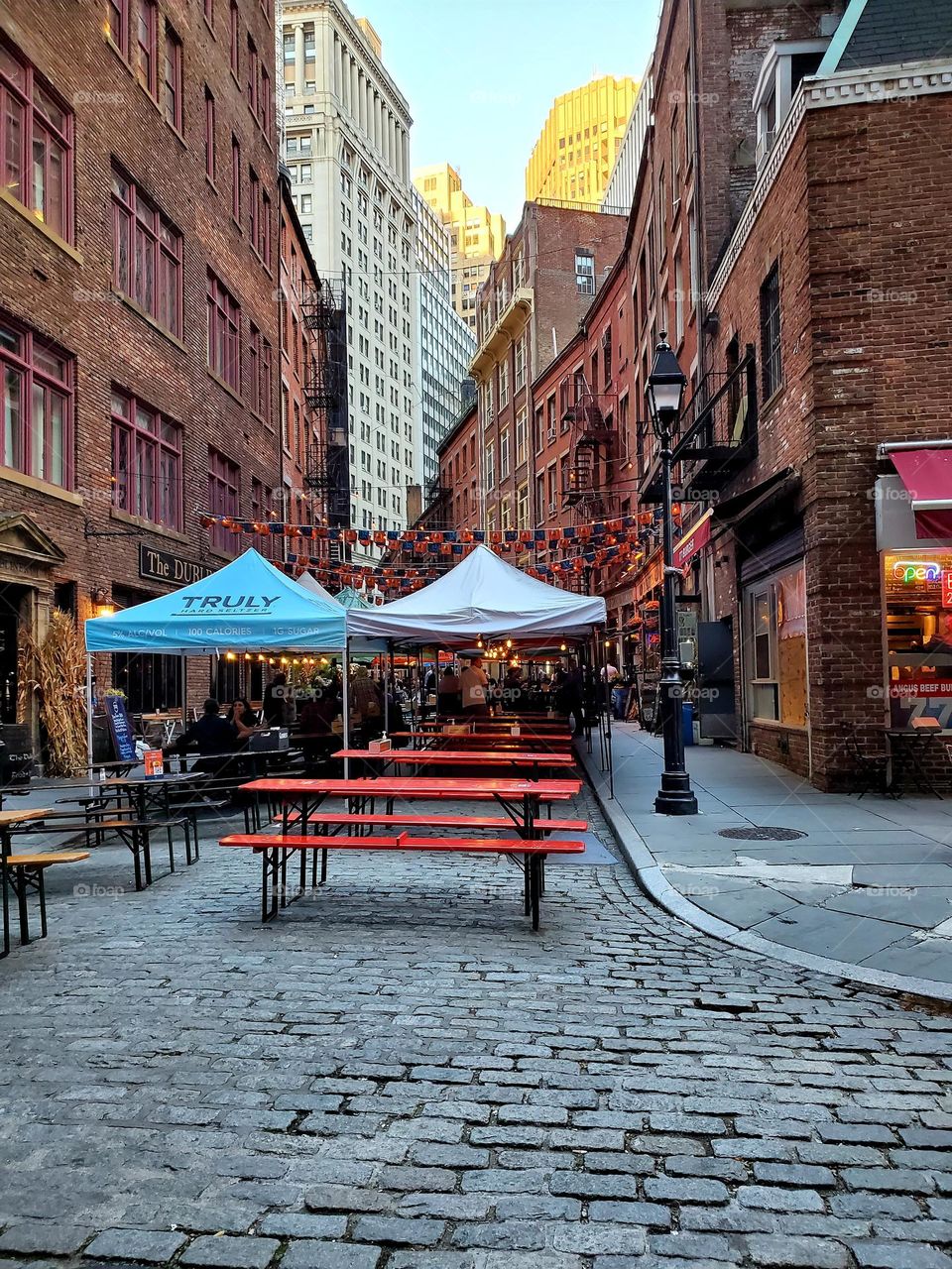 A New York City street in the old Town hosts several businesses