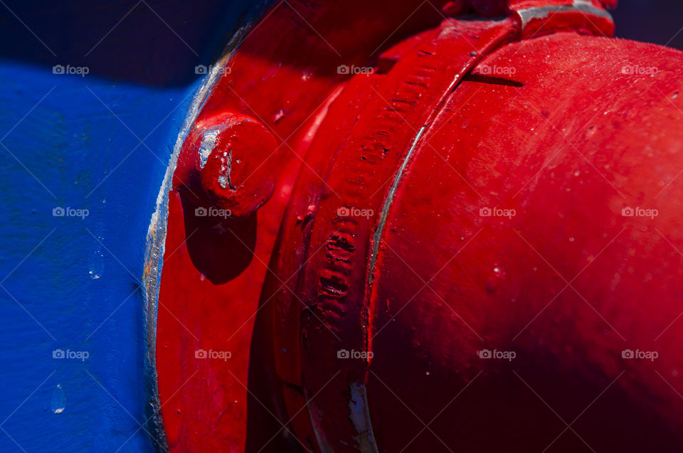 red plumbing pipe on blue background