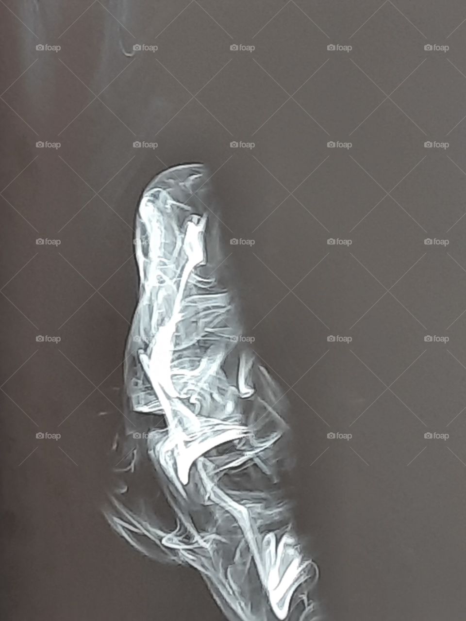 Sunray fallen in to incense stick smoke make beautiful designs