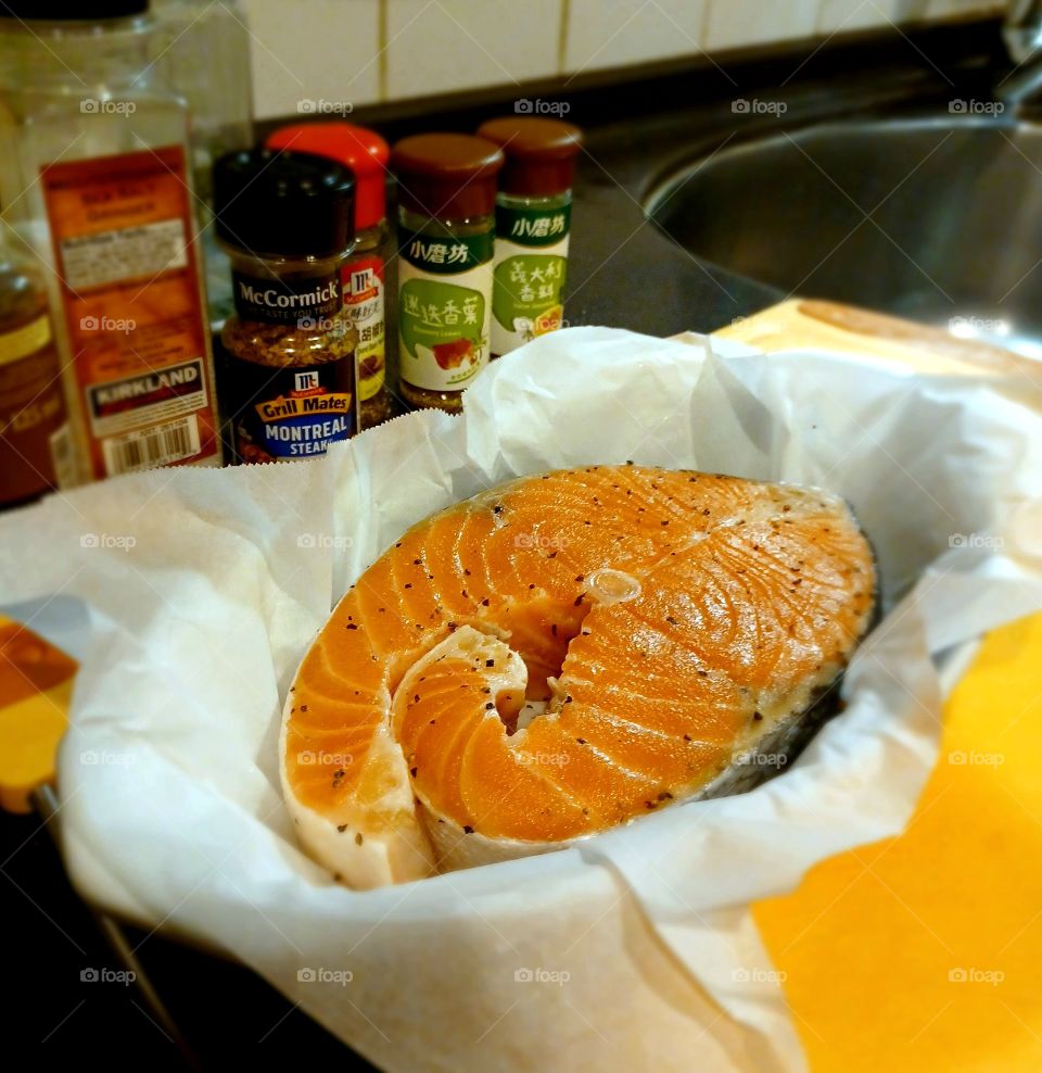 Fresh salmon with seasoning.