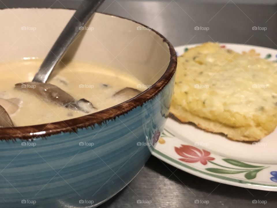 Yummy chicken mushroom soup with garlic bread