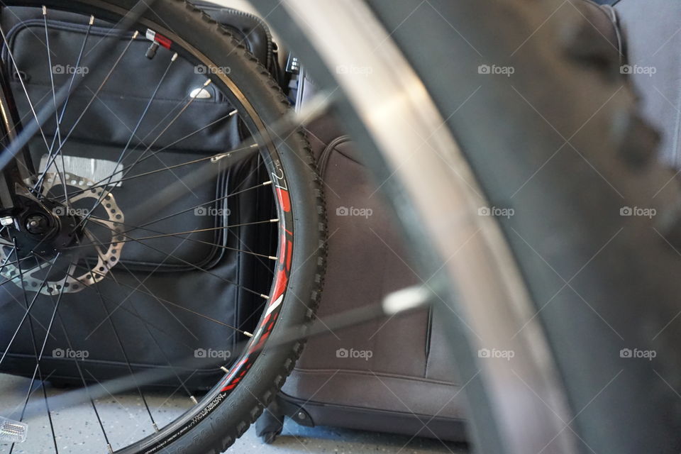 A bikes wheels in a garage