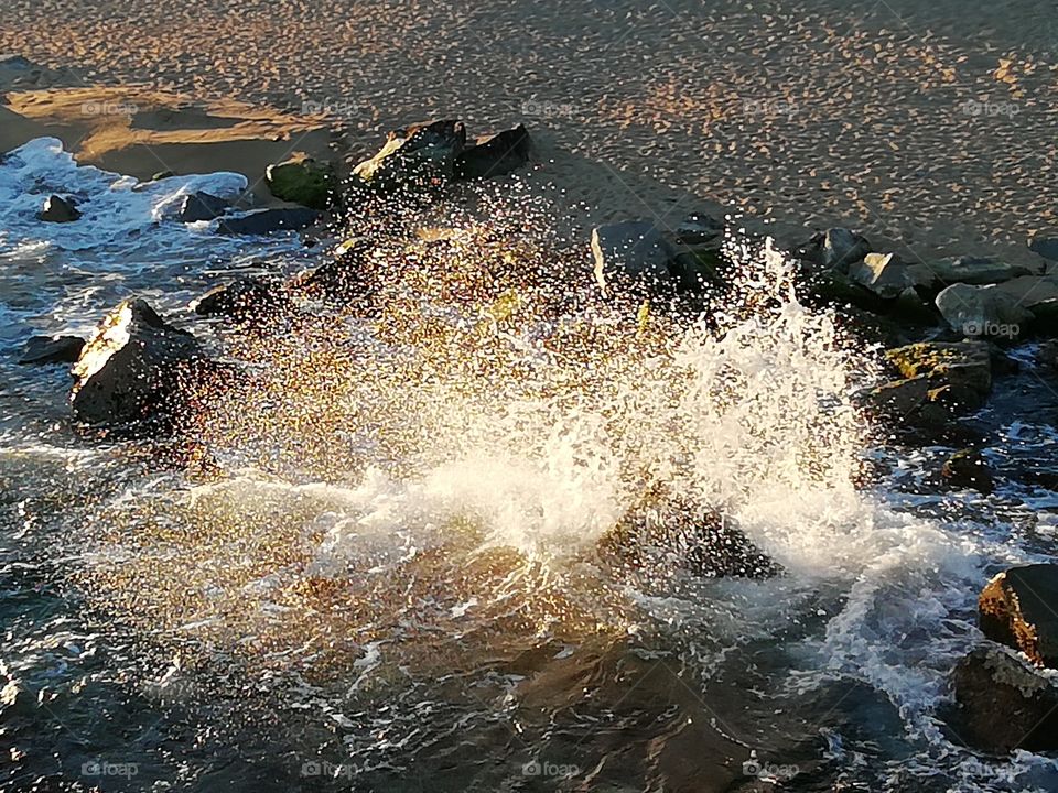 Seawater spraying in the rocks