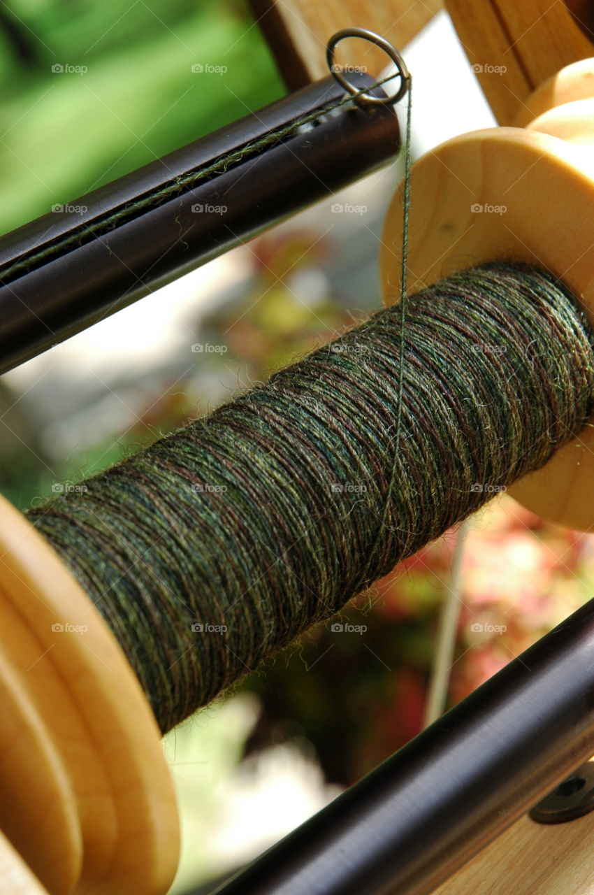 Bobbin Shot. Spinning singles onto a bobbin with a spinning wheel