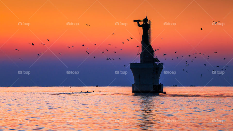 Sunrise and lighthouses at Haeundae beach, Busan, South Korea