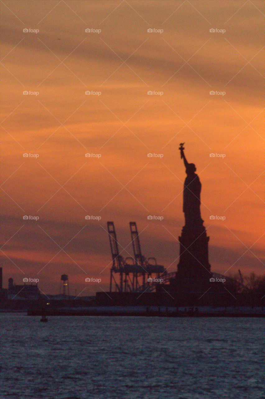 Sunset statue if liberty