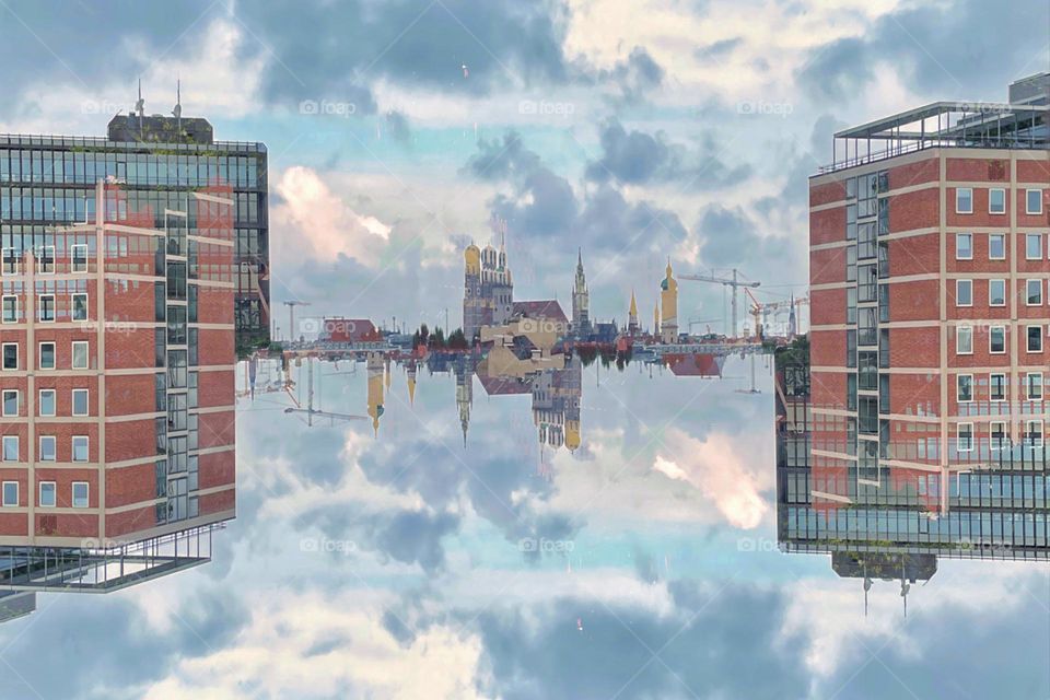 Cityscape with red house and cloudy sky artistically alienated by double exposure and reflection