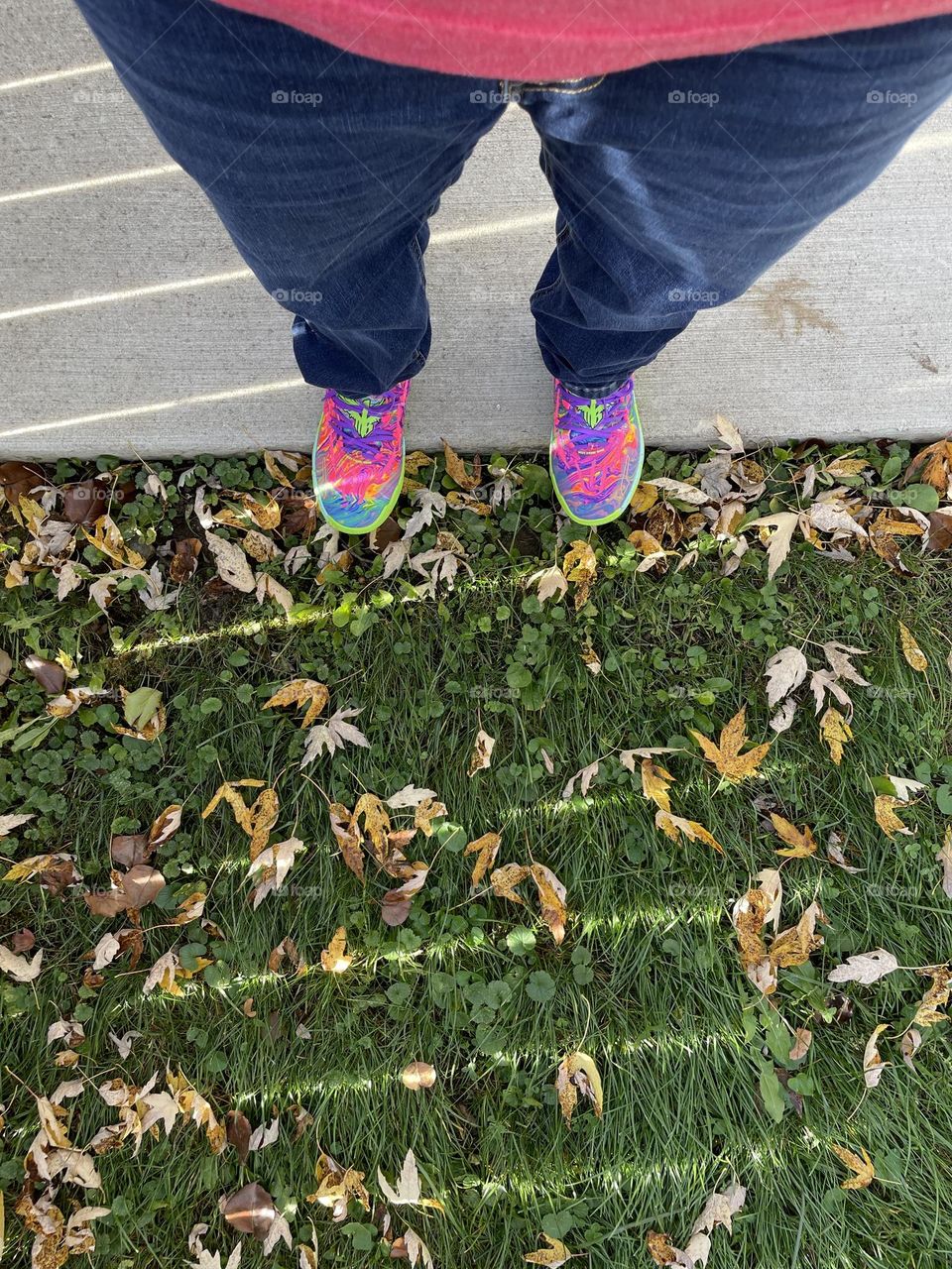 Brightly colored shoes and fall leaves, walking in the leaves, fall time fun