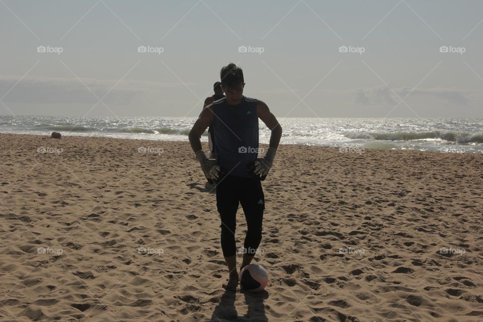 A beach soccer goalkeeper at his training section