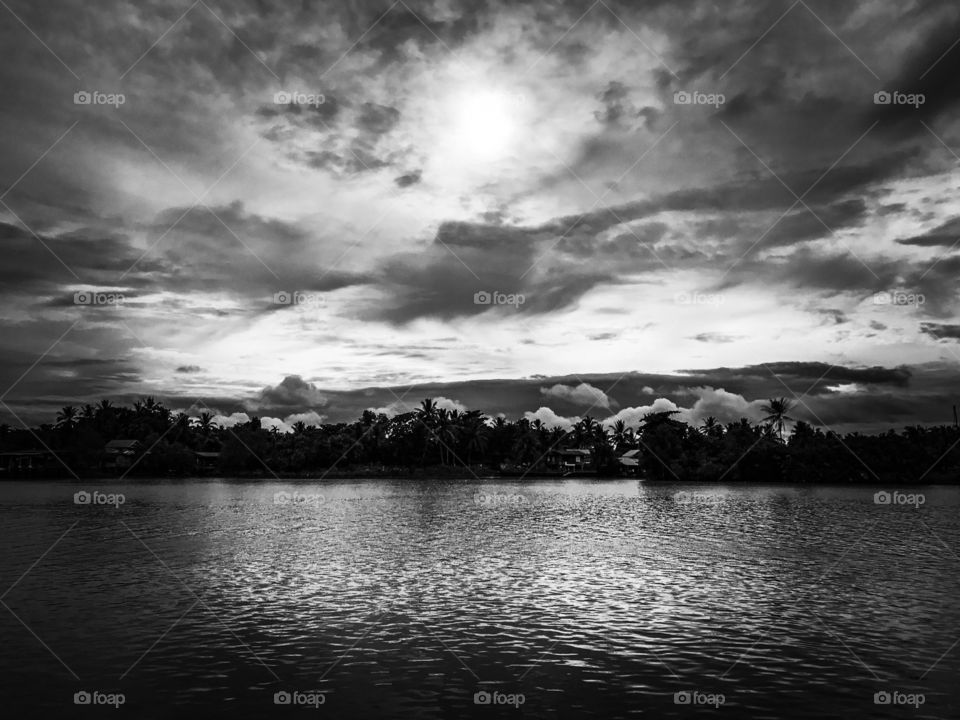 Cloudy sky over the Tapi River in Surat Thani, southern Thailand, before storm approach
