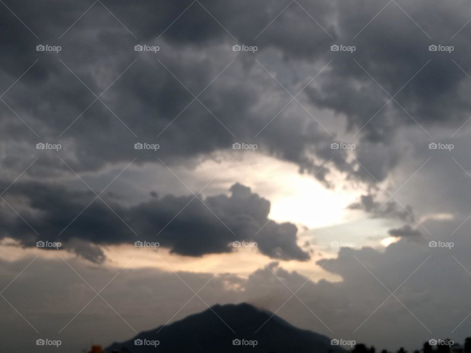 *Ravarma*  Mountain, Gray clouds, Spiralling evening