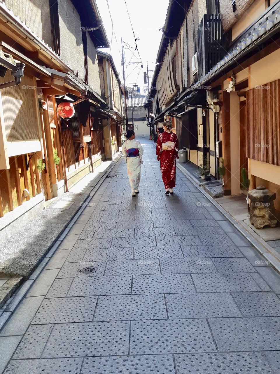Touring fun in Japan. Beautiful kimono walking in the streets 
