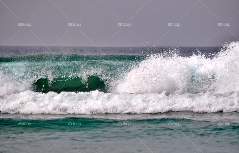 surfing on famara beach on lanzarote canary island in Spain