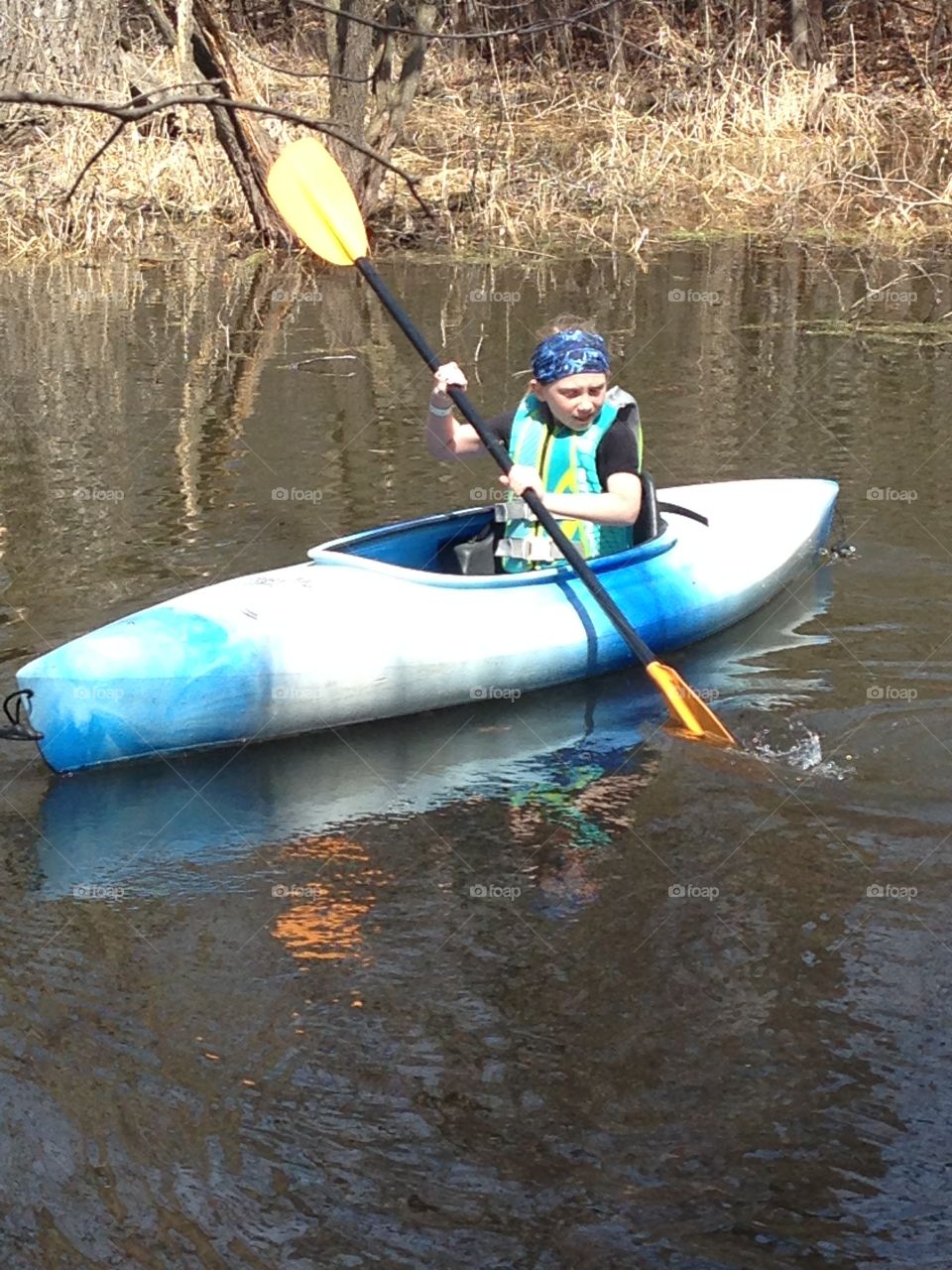 Kayaking Solo. Daughter wanted to try daddy's kayak. She figured it out quick! And look, she's even sporting her Buff!