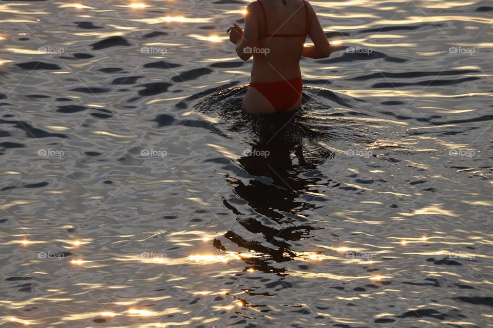 Taking a dip in cold ocean 