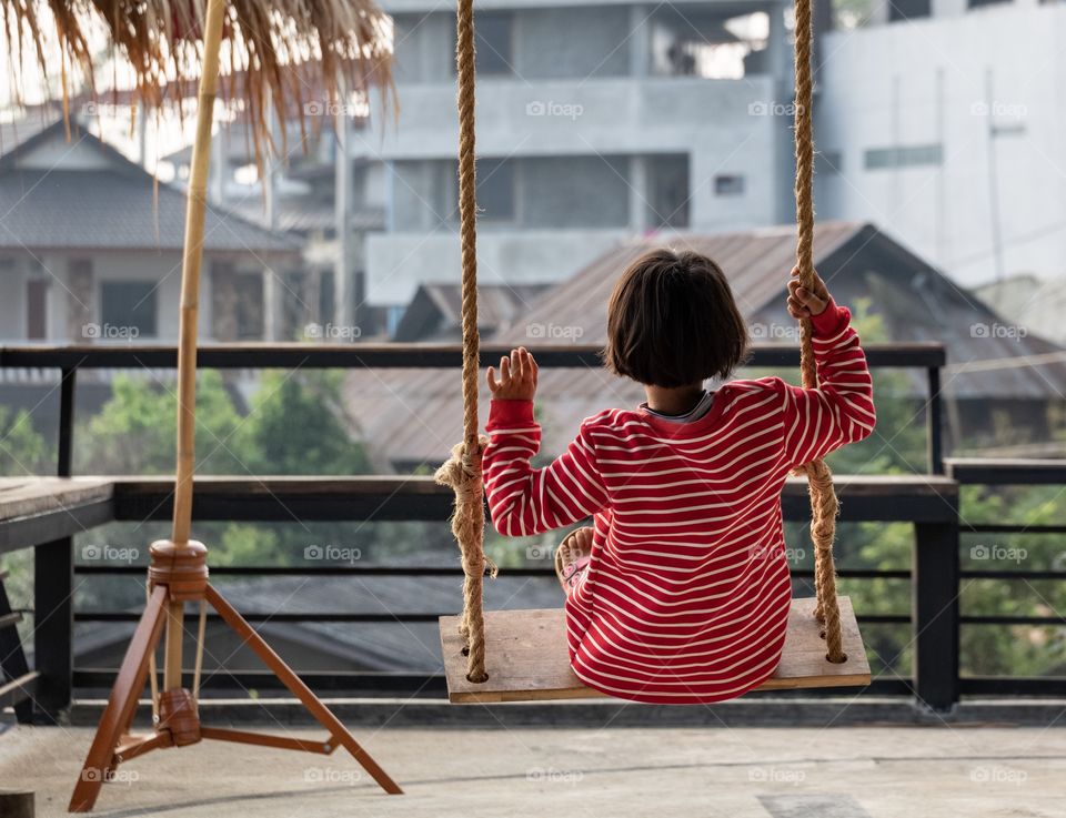 Cute girl play swing