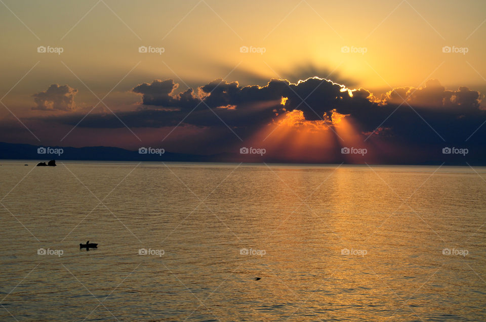 Scenic view of sea at sunset