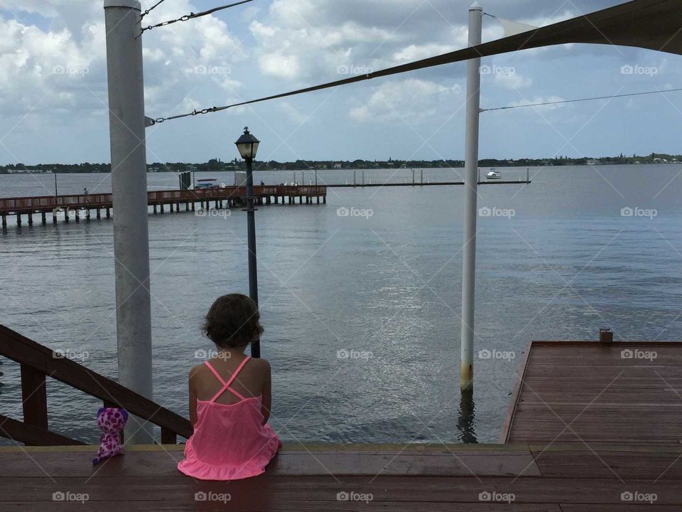 sitting on a dock