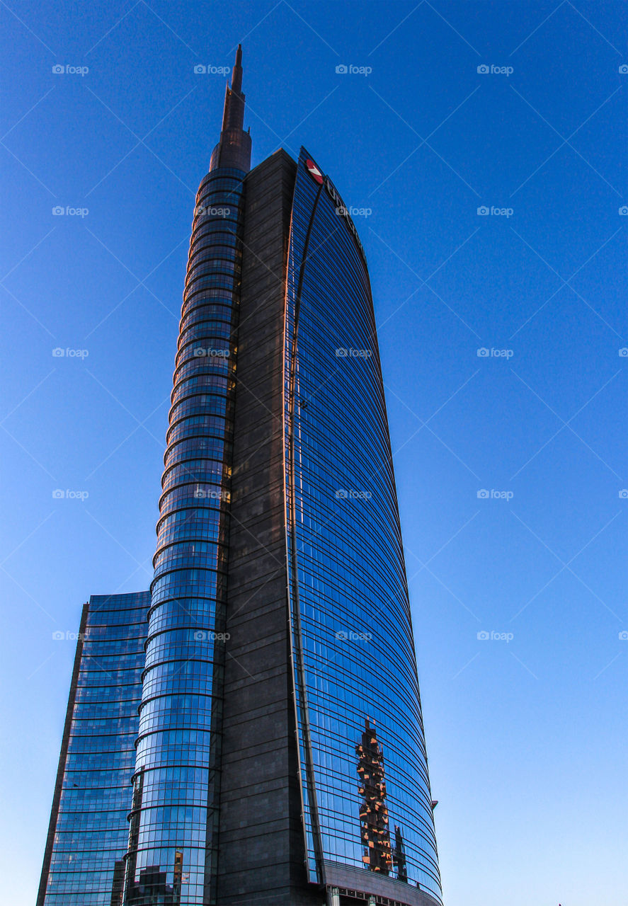 Uni credit building, and the famous building from Milan is reflected on it.