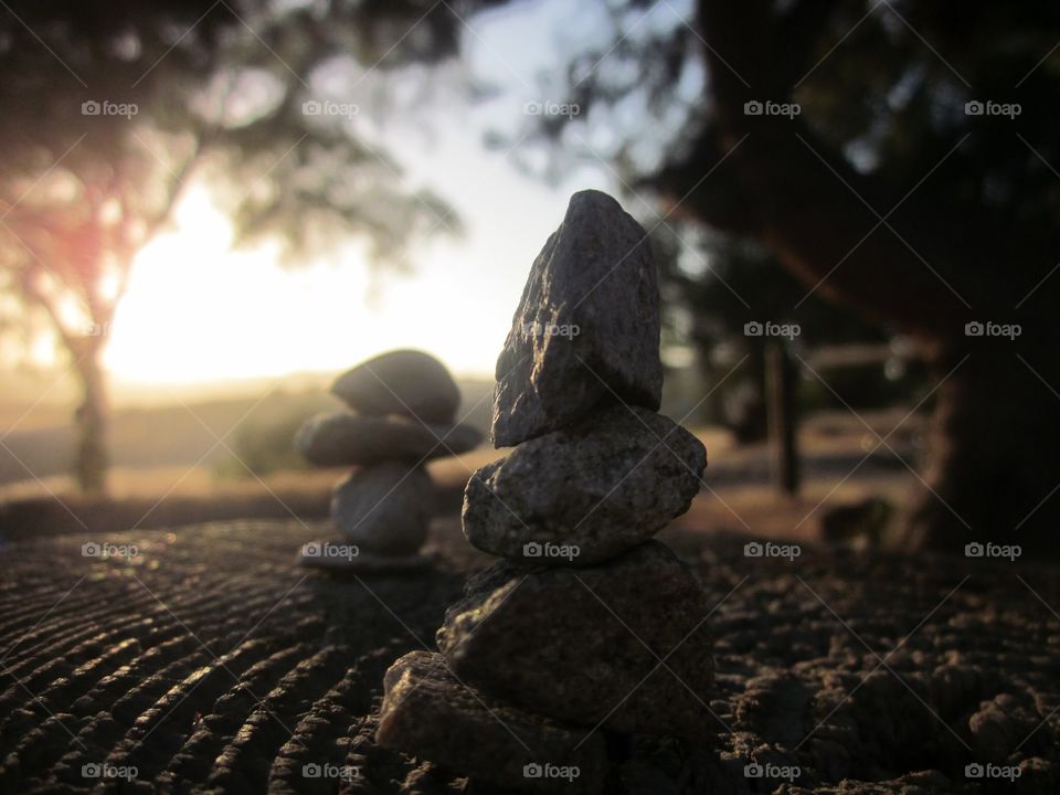 Zen rock stack at sunset 