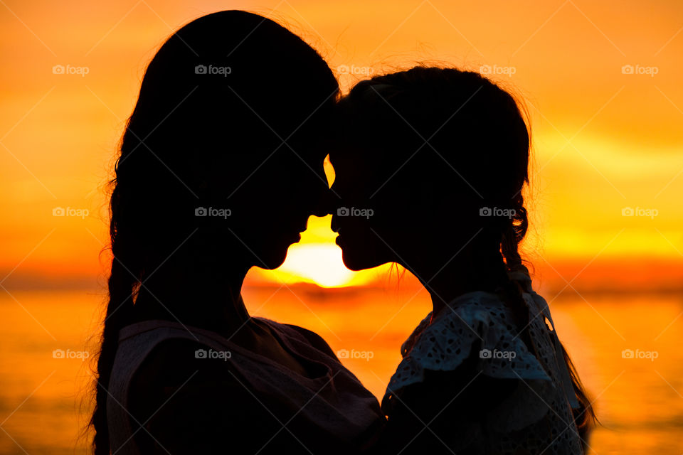 Silhouette of mother and 