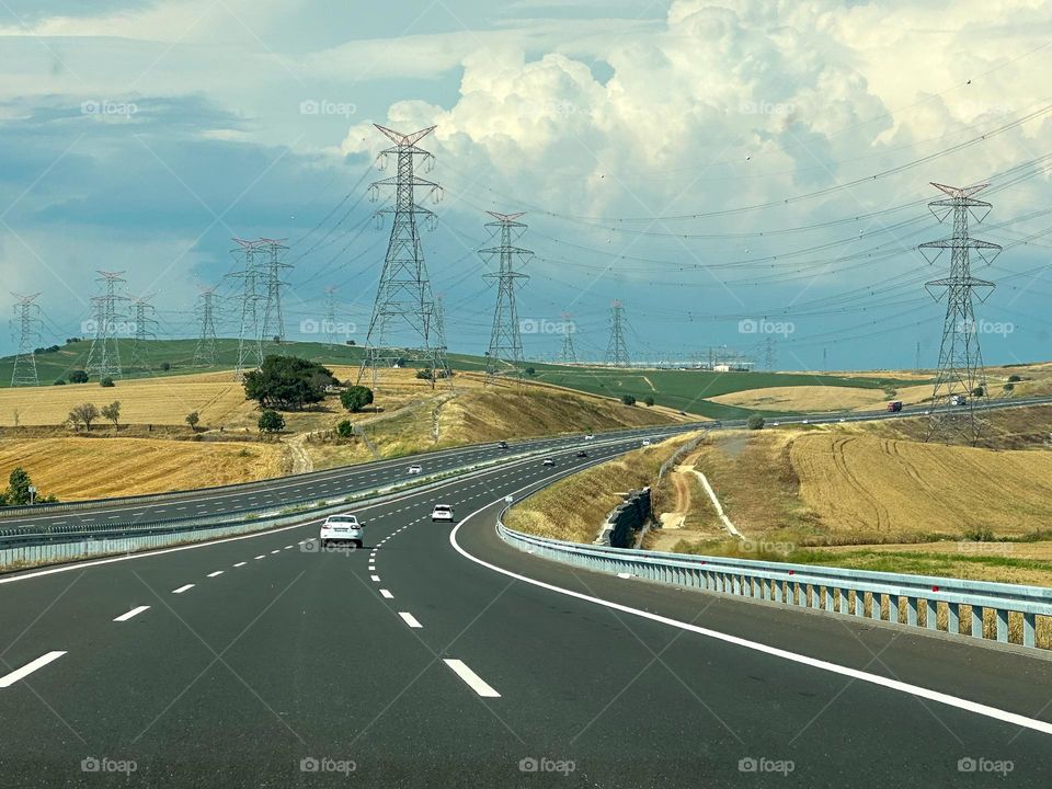 Driving through wheat fields and power line poles 