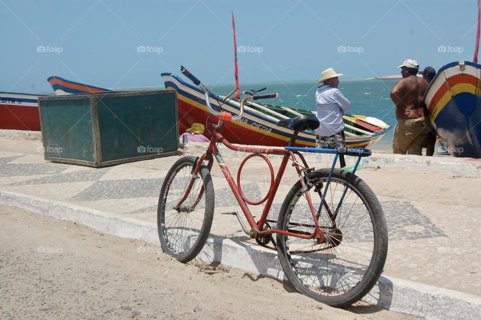Red bycicle near sea 