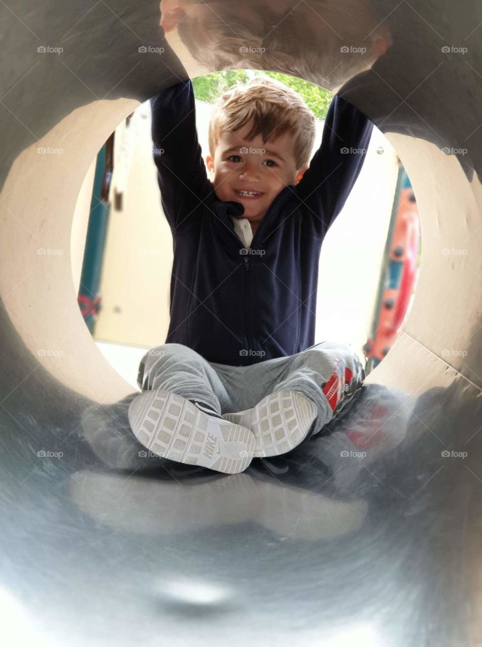Boy in playtunnel