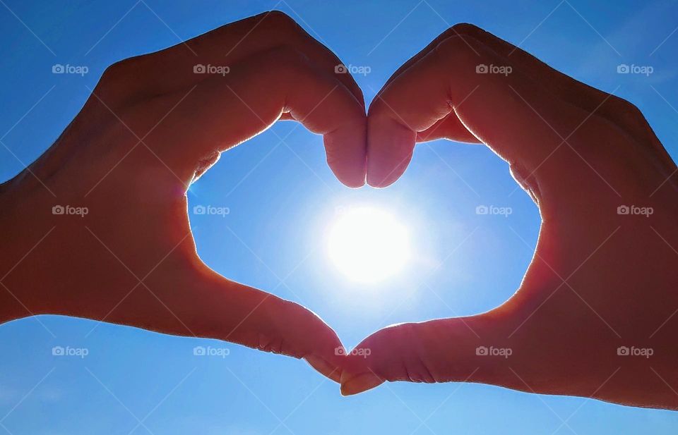 The heart from the hands 💙 The sky and the sun💙🌞