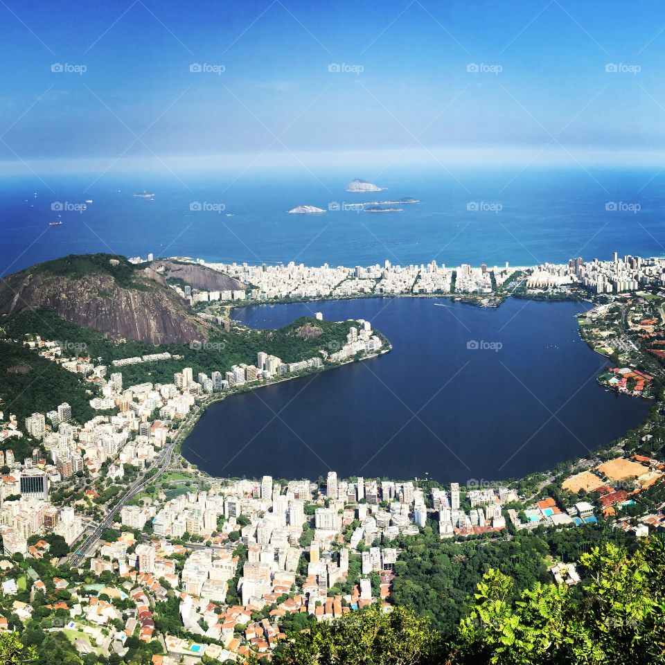 Rio de Janeiro from Corcovado . Rio de Janeiro's Ipanema and Lagoa neighborhood viewed from the Corcovado hill and Christ the Redeemer statue. 
