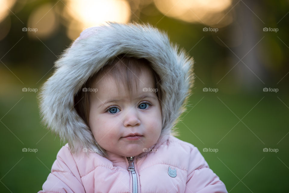 baby girl wearing fur hood