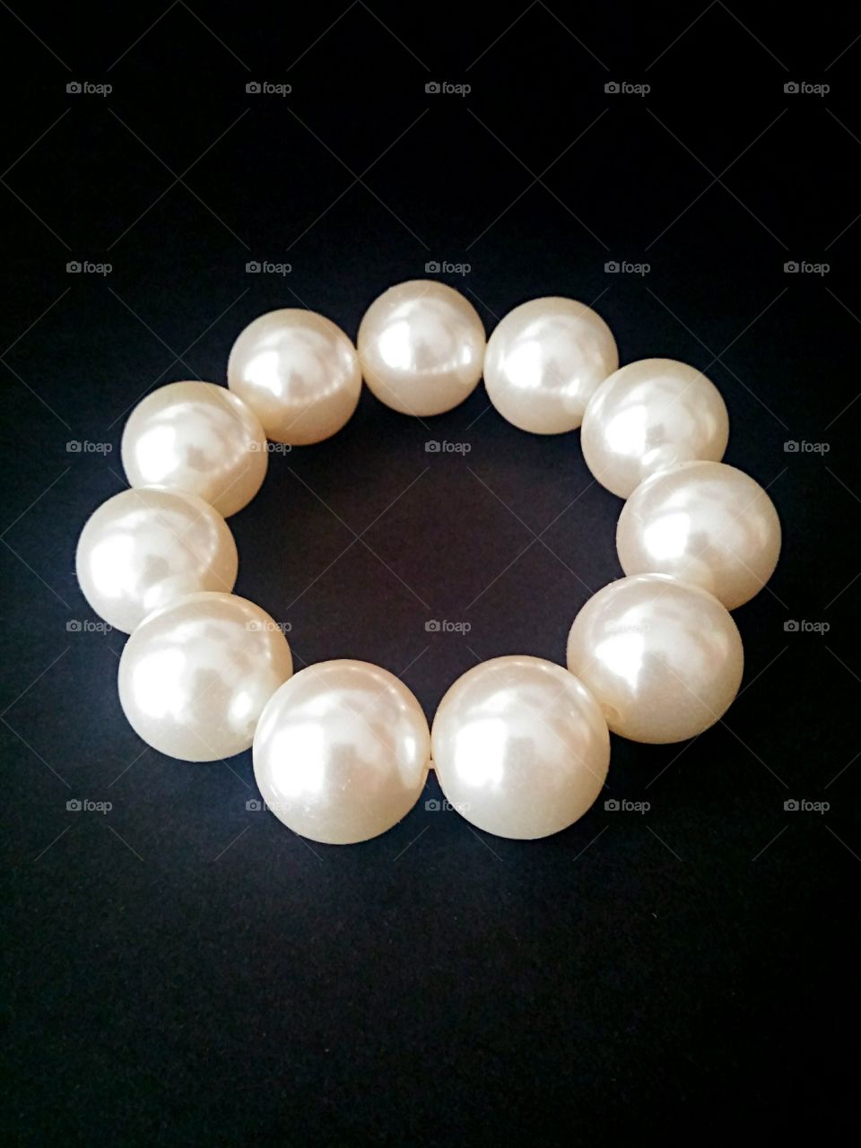 Pearl bracelet on black background