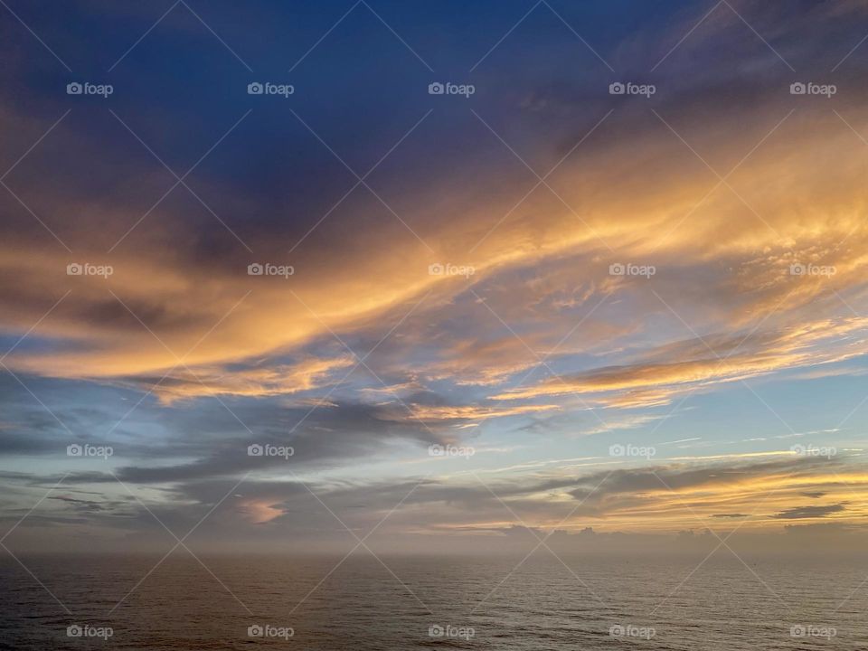 Clouds and fog over the ocean at sunset 