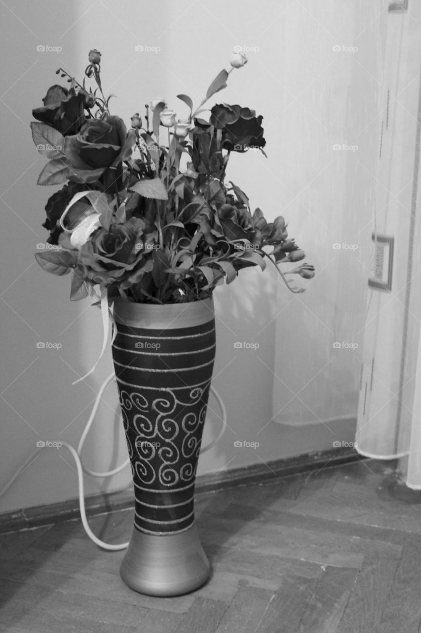 black and white decorative vase with artificial flowers