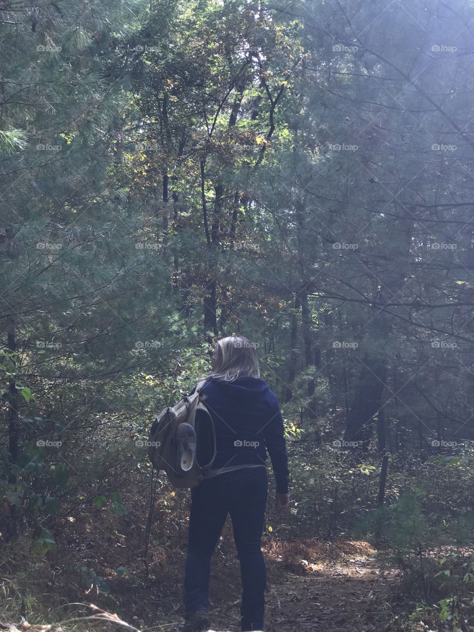 Hackers Falls hiking in Milford, PA; Pike County; Delaware Water Gap National Recreation Area; Woman standing on trail with hiking pack