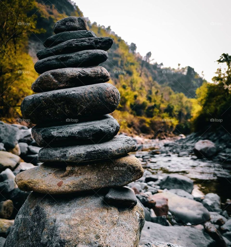 take the stones people throw at you use them to build a monument